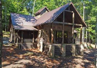 Natural poplar bark siding, Hemlock logs and ashlar stone clad this modern cottage, Ellijay, North Georgia